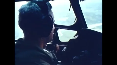 1963 – U.S. Airforce parachute troops over vietnam Stock Footage 76789093