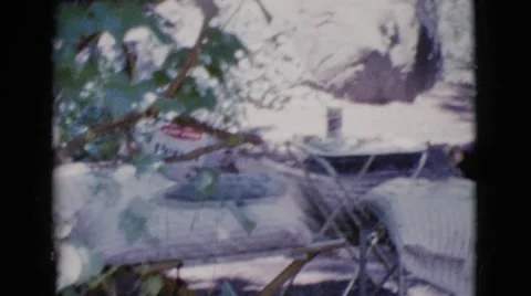 1964: a handsome, shirtless man stepping out from a recreational vehicle Stock Footage
