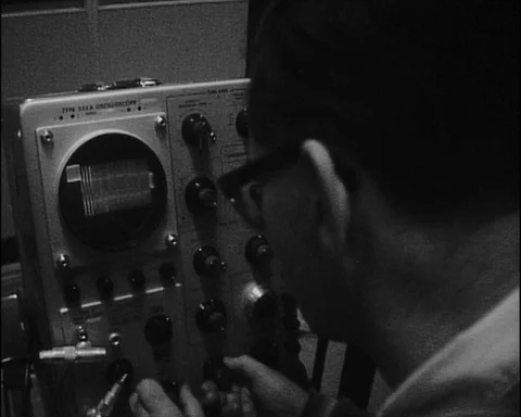 (1964) Man Operating Oscilloscope Device Stock Footage 99862244