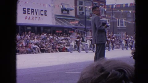 1964: motorbikes coming down road in local parade HARVARD, ILLINOIS Stock Footage
