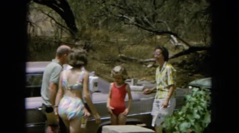 1964: people getting ready to swim outdoors on a trip HAWAII Stock Footage