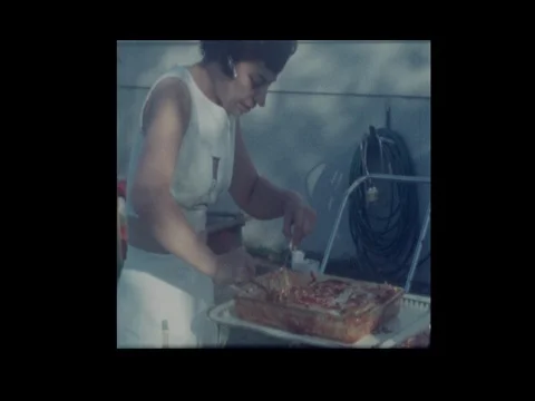 1964 Woman serves lasagna to family Stock Footage