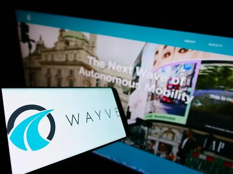 Mobile phone with logo of British company Wayve Technologies Inc. on screen in front of business website. Focus on center-left of phone display. xkwx wayve, technologies, inc, logo, vehicle, software, self-driving, autonomous, driving, company, artificial, intelligence, automotive, background, british, business, car, cellphone, computer, deep, learning, device, display, editorial, electric, front, homepage, illustrative, internet, london, mobile, phone, monitor, online, screen, selective, focus, site, smartphone, technology, trademark, uk, united, kingdom, web, page, website, advertisement, marketing