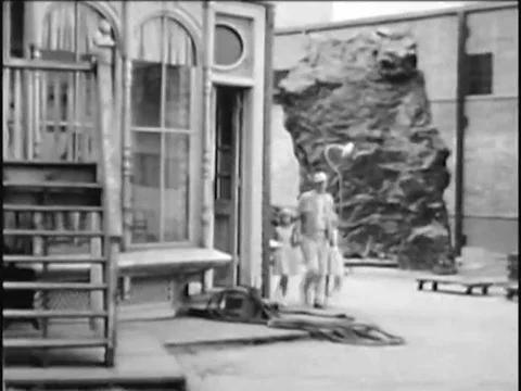1965 _ Ken Murray shows his daughters a set on the Paramount lot. Stock Footage