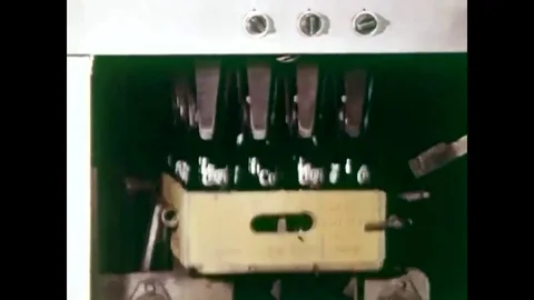 1965 - Cases of Coca-cola are stored and loaded onto trucks to be transported to Stock Footage 79559095