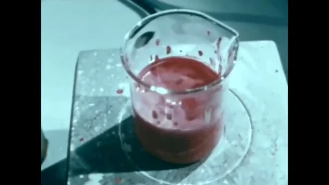 1965 - Chemists at NASA develop paint that will withstand space travel. 動画素材 95642370