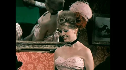 1965 - Gamblers play the shell game in an Old West saloon. Stock Footage 101699927