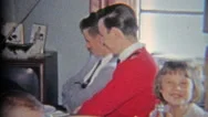 1965: Large Family Of Youngsters Sitting Around The Golden Television. Stock Footage