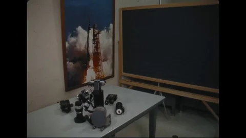 1965 - A NASA Engineer tests lens equipment at the Kennedy Space Centre. Stock Footage 112534336