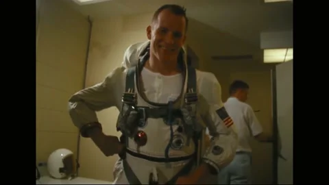 1965 - NASA technicians help Michael Collins, Frank Borman, Jim Lovell and Ed Stock Footage 232848371