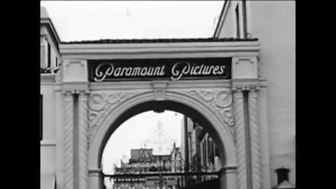 1965 A shot of the front gate at Paramount studio, and Frank Capra receives a Stock Footage 115545581