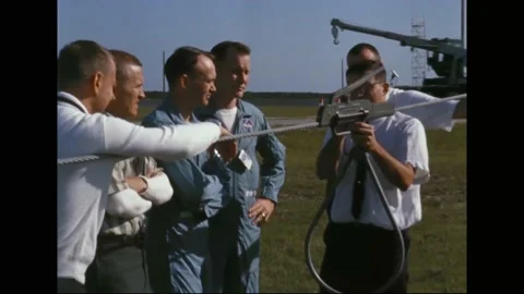 1965 - Technicians show astronauts Frank Borman, Jim Lovell, Ed White and Stock Footage 232849519