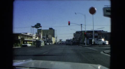 1966: approaching and stopping at a red light in a vehicle CATALINA, CALIFORNIA Stock Footage