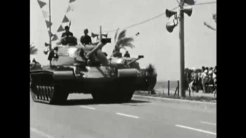 1966 - Army tanks are driven down the street in an Israel Defense Force military Vídeos de archivo 110862919