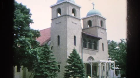1966: car with balloons driving my a church DANVILLE, ILLINOIS Stock Footage
