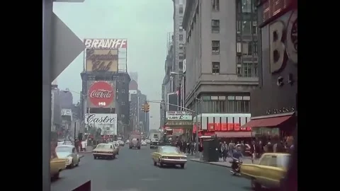 1966 - Cars drive through Times Square i... | Stock Video | Pond5