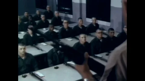 1966 - An instructor lectures on 7.62mm, M14 Rifles and recruits march during Vídeos de archivo 83417745