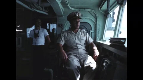 1966 - A messenger brings a note to Captain Bee on the bridge of the USS Iwo Stock Footage 106901618