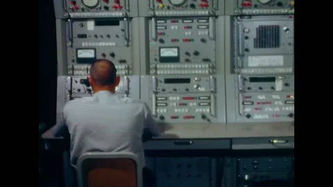 1966 - Operator at an S-band console aboard the USNS Vanguard, the Apollo Stock Footage 205601842