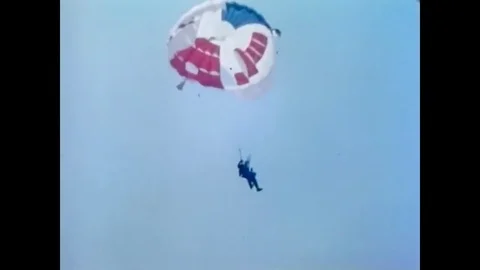 1966 - parachutists learn what to do if they land among wires or in a tree. Video stock 83083461