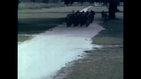 1966 - Recruits use teamwork while running with 7.62mm, M14 Rifles and a drill Vídeos de archivo 83417810