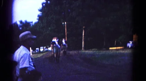 1966: a single line of men marching past observer wearing uniforms Stock Footage