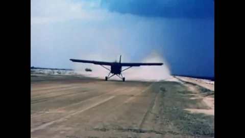 1966 - A soldier sets up a static line for parachuting on an aircraft. Видео 83083519