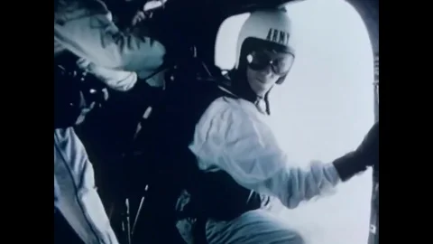 1966 - Soldiers exit a plane on a static line parachute drop. Stock Footage 83083535
