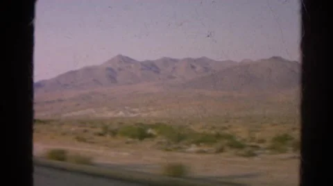 1966: view from moving car during road trip mountains west desert horizon Stock Footage