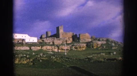 1966:SPAIN. An Old Aztec Structure Surrounded By Beautiful Green Palm Trees Fotos de archivo