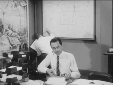 1967 _An officer broadcasts information about a radiological hazard, and an Stock Footage