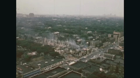 1967 - Aerial views of burning and destroyed buildings during the Detroit Riots. Stock Footage