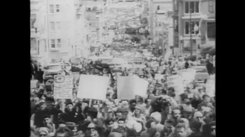 1967 - Anti-war protestors march down Market Street in San Francisco, Stock Footage