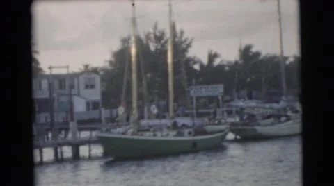 1967: boat watching in the harbor at sunset from the deck of the family boat Stock Footage
