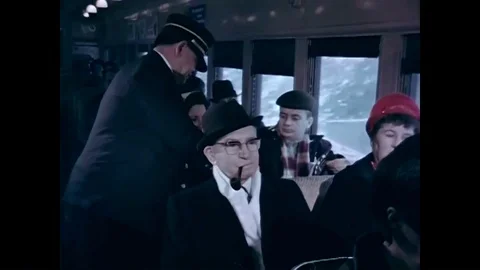 1967- A conductor collects a fare from a passenger aboard a train, and Stock Footage