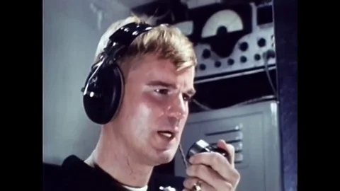 1967 - The crew of a United States Navy submarine tracks an enemy sub with sonar Stock Footage