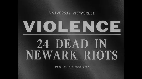 1967 - Firemen put out flames and cops arrest protestors after race riots erupt Stock Footage 130817426