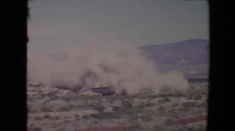 1967: large sand storm moving through desert engulfing homes in it's path Stock Footage