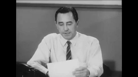 1967 A supervisor gives a forecast, and an analyst plots information during a Stock Footage 115546655