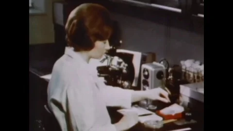 1968 - Algae is studied under a microscope and given a shaker test at the United Stock Footage 79449349