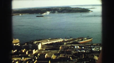 1968: the calm water of the shipping docks and all the buildings Stock Footage