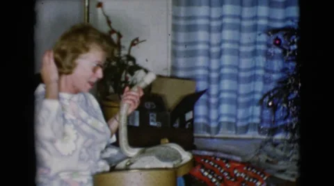 1968: a christmas tree is seen with a child opening presents CLARKSDALE, ARIZONA Stock Footage