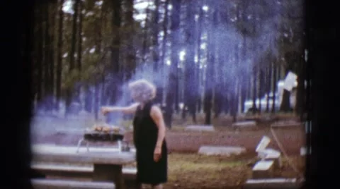 1968: cooking barbecue in the forest COTTONWOOD, ARIZONA Stock Footage