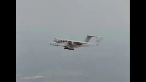 1968 - A Forward Air Controller takes note of the terrain below him on a Stock Footage 107738336