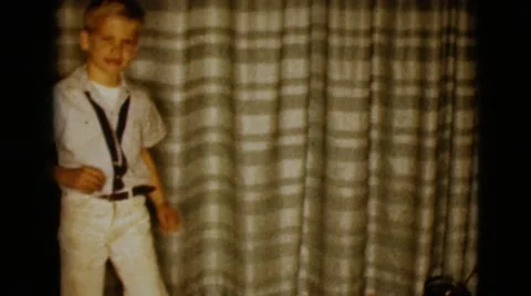 1968: limping boy pops a squat CLARKSDALE, ARIZONA Stock Footage