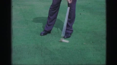 1968: Man Putting Golf Balls on Practice Green Bullseye Putter Club Cedar Rapids Stock Footage 63661285