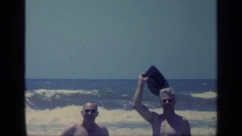 1968: People Standing on a Florida Beach Stock Footage 73043377