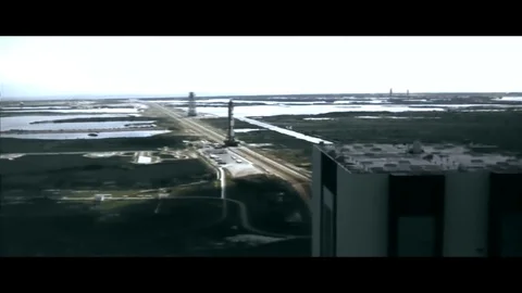 1968 - The Saturn V rocket is slowly moved on the crawler transporter to its Stock Footage 86136285