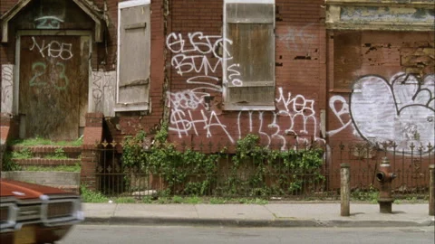 A 1968 Thunderbird turns a corner in the Bronx 1970s Stock Footage 273401902