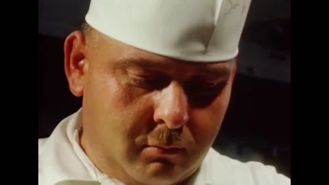 1968 - US Navy cooks prepare ham for Easter dinner on the USS Kitty Hawk. Stock Footage 161014506